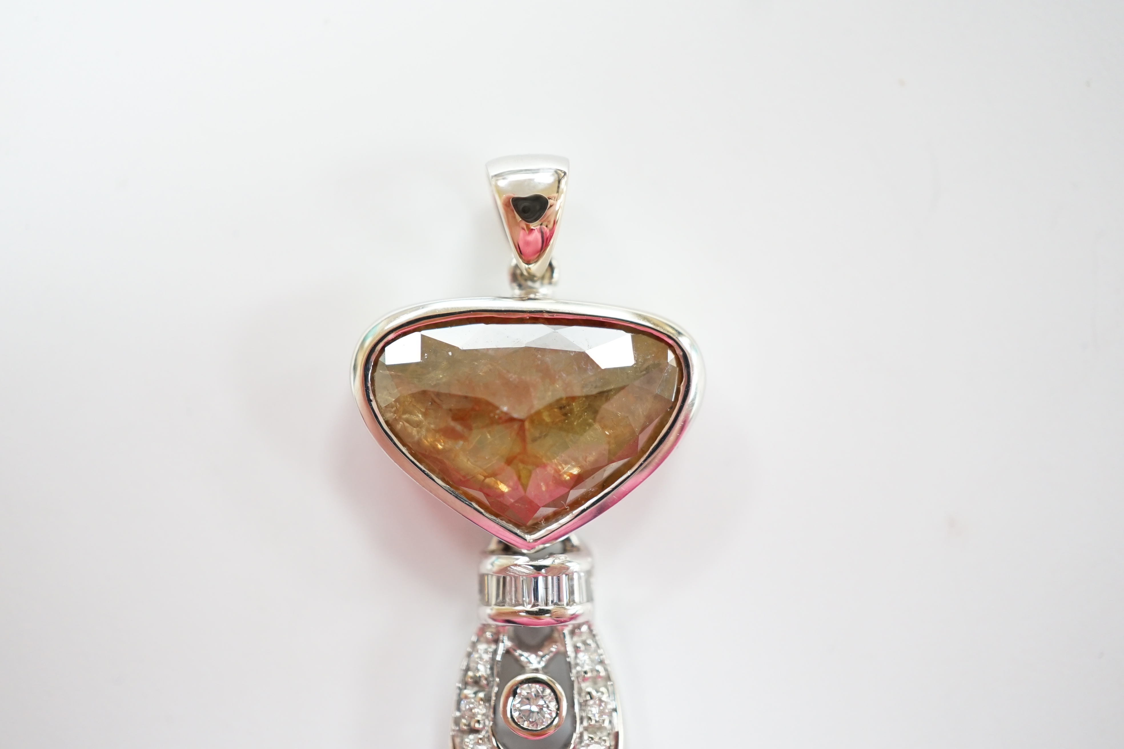 A 750 white metal and single stone fancy cut diamond set pendant, with diamond cluster set drop, overall 30mm, gross weight 5 grams.